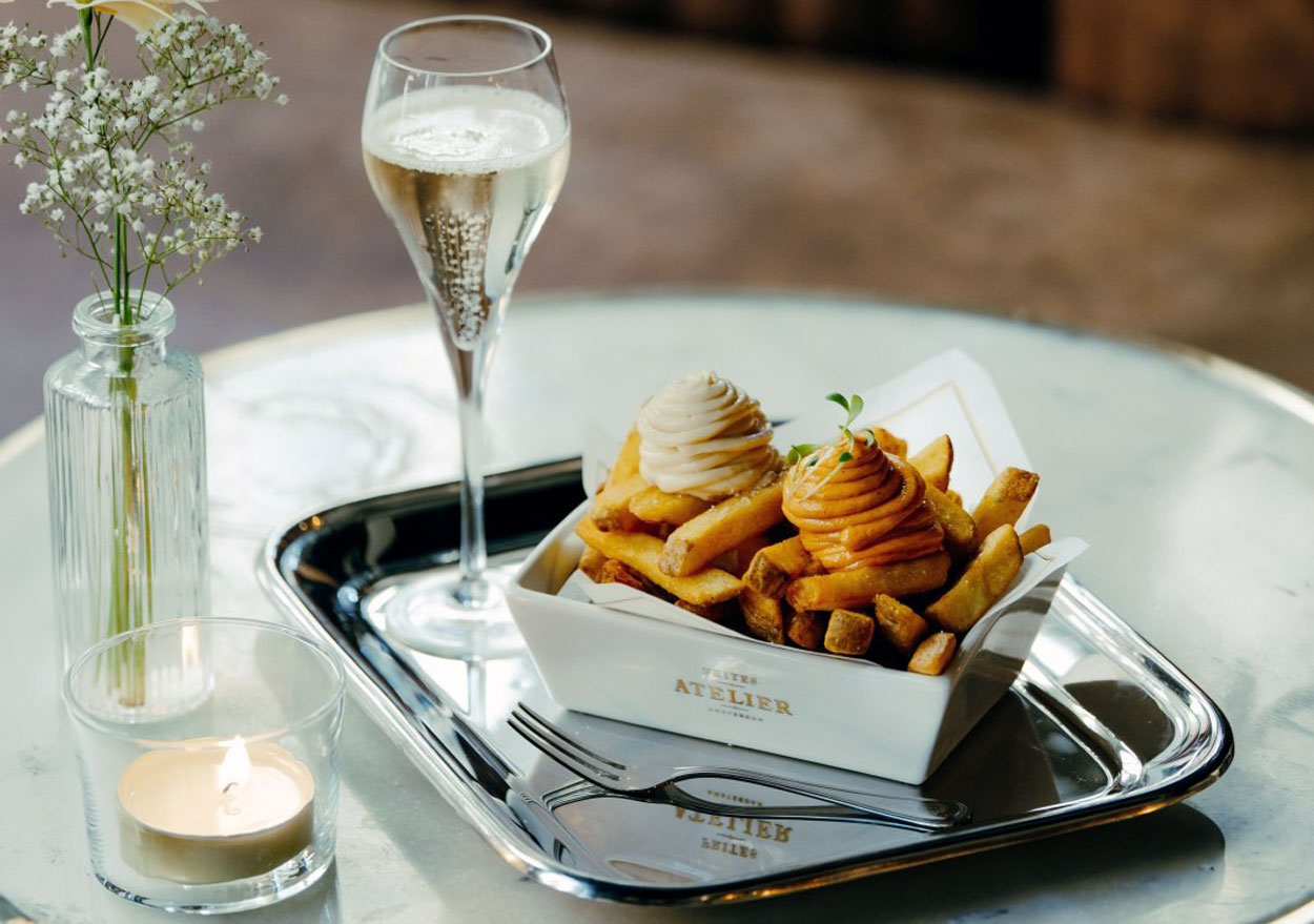 Frites Atelier verruilt wegwerpbakje voor porselein in Belgische vestigingen